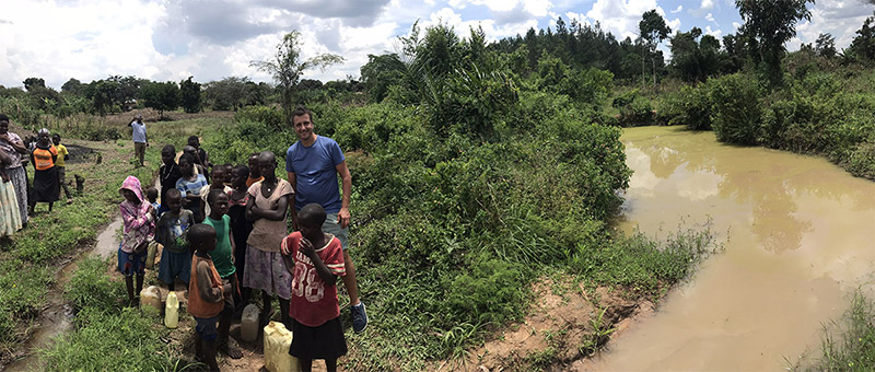 Our water project director, Richard, in Uganda visiting a village’s drinking water source.